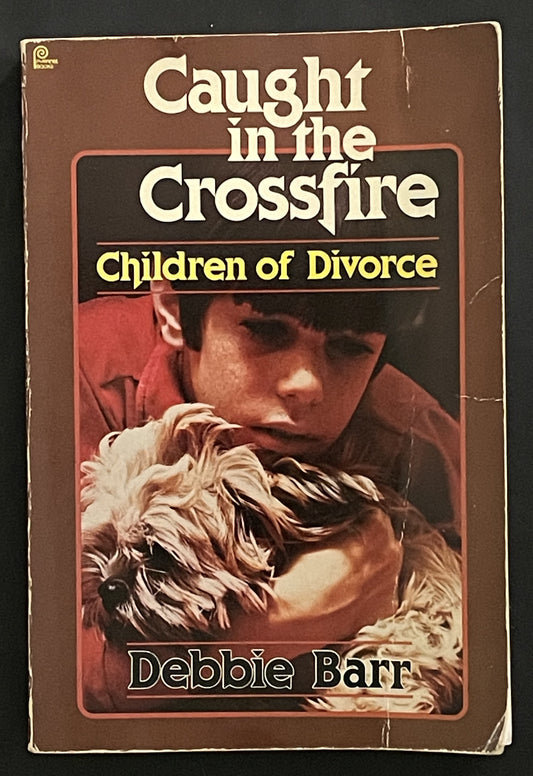 Caught in the Crossfire by Debbie Barr